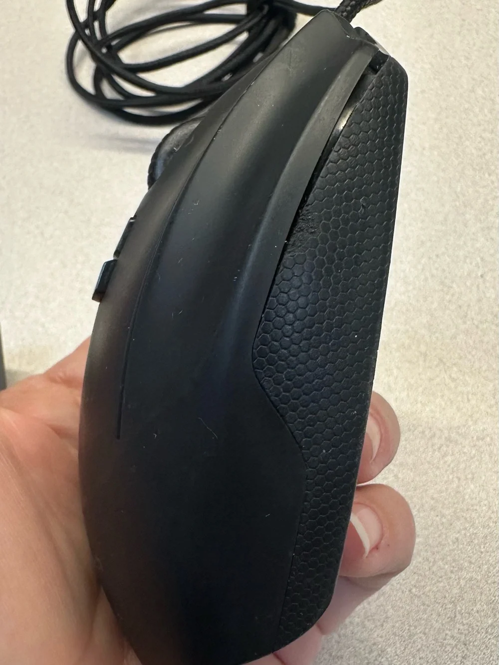 Logitech G600 Black Wired Ergonomic Gaming Mouse with 12 button thumb grid.